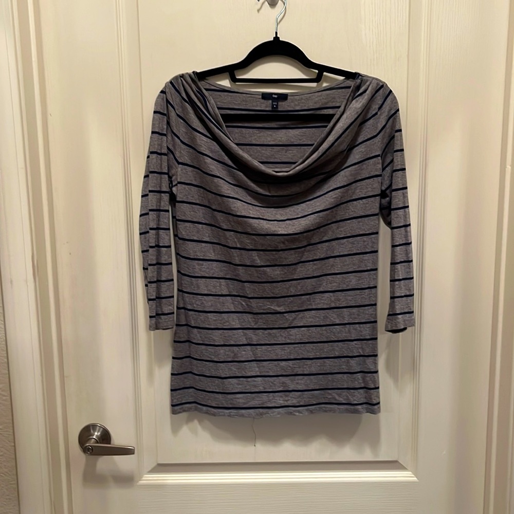 Dark gray and navy blue striped cowl neck shirt.